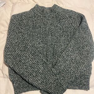 Green and white knit sweater